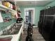 Small kitchen area with stainless steel refrigerator, and stainless steel sink at 1718 Pucketts Sw Dr, Lilburn, GA 30047