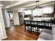 Spacious kitchen featuring white cabinets, stainless steel appliances, and a large center island with seating at 1718 Pucketts Sw Dr, Lilburn, GA 30047