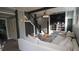 A cozy living room with light gray walls, black and white trim, and a contemporary ceiling fan at 1718 Pucketts Sw Dr, Lilburn, GA 30047