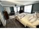 Spacious main bedroom offers ample natural light, wood-look floors, and decorative furnishings at 1718 Pucketts Sw Dr, Lilburn, GA 30047