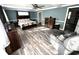 Spacious main bedroom offers ample natural light, wood-look floors, and decorative furnishings at 1718 Pucketts Sw Dr, Lilburn, GA 30047