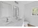 Modern bathroom featuring dual sinks, framed mirrors, and a clean white design for a refreshing and bright space at 3406 Randell Brown Avenue Unit 3, Atlanta, GA 30354