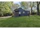 Charming single-story home with a well-manicured lawn and a cozy front porch surrounded by mature trees at 3406 Randell Brown Avenue Unit 3, Atlanta, GA 30354