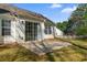Spacious backyard with a concrete patio and glass sliding doors at 5882 Riverside Walk Dr, Sugar Hill, GA 30518