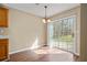 Cozy breakfast nook featuring wood floors and a sliding glass door with backyard views at 5882 Riverside Walk Dr, Sugar Hill, GA 30518