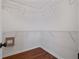Empty closet with hardwood floors and white metal shelving at 5882 Riverside Walk Dr, Sugar Hill, GA 30518