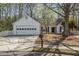 Charming single-story home featuring a well-manicured front yard, attached garage, and inviting entrance at 5882 Riverside Walk Dr, Sugar Hill, GA 30518