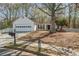 Charming single-story home featuring a well-manicured front yard, attached garage, and inviting entrance at 5882 Riverside Walk Dr, Sugar Hill, GA 30518
