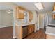 Open kitchen with stainless steel dishwasher and view to other rooms at 5882 Riverside Walk Dr, Sugar Hill, GA 30518