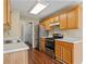 Well-lit kitchen with stainless steel appliances, and sleek countertops at 5882 Riverside Walk Dr, Sugar Hill, GA 30518