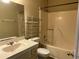 Bathroom with a single sink vanity, toilet, and a shower/tub combo at 6113 Princeton Ave, Morrow, GA 30260