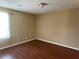 Spacious bedroom showcasing wood flooring and neutral paint at 6113 Princeton Ave, Morrow, GA 30260
