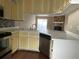 Kitchen featuring yellow cabinets, stainless steel appliances, and stylish countertops at 6113 Princeton Ave, Morrow, GA 30260