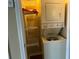 Laundry closet with a stacked washer and dryer at 6113 Princeton Ave, Morrow, GA 30260