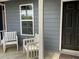 Inviting porch area with a comfortable seating area and natural light at 6113 Princeton Ave, Morrow, GA 30260