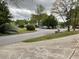 Neighborhood street view featuring sidewalks, landscaping, and charming homes, perfect for peaceful living at 6113 Princeton Ave, Morrow, GA 30260