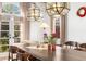 Bright dining space featuring an oversized table with views to the yard through elegant french doors at 1311 Berwick Ne Ave, Atlanta, GA 30306
