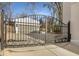 Wrought iron gate provides security and charm, leading to a private driveway and detached garage at 1311 Berwick Ne Ave, Atlanta, GA 30306