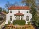 Stunning two-story home with a red tile roof and manicured front yard, offering timeless elegance and curb appeal at 1311 Berwick Ne Ave, Atlanta, GA 30306