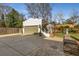 Detached two car garage with a concrete driveway and stone accents at 1311 Berwick Ne Ave, Atlanta, GA 30306