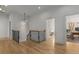 Bright hallway with wood floors, modern lighting, and access to multiple rooms, exuding openness at 1311 Berwick Ne Ave, Atlanta, GA 30306