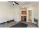 Well-lit home gym with a small kitchenette and open doorway to another room at 1311 Berwick Ne Ave, Atlanta, GA 30306