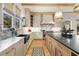 Bright kitchen with a large island, lots of windows, and marble countertops and backsplash at 1311 Berwick Ne Ave, Atlanta, GA 30306