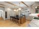 Gourmet kitchen featuring a large center island with seating, marble countertops, and stainless steel appliances at 1311 Berwick Ne Ave, Atlanta, GA 30306