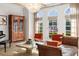 Bright and airy living room with French doors, wooden floors, and a stylish cabinet at 1311 Berwick Ne Ave, Atlanta, GA 30306