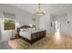 Spacious main bedroom with hardwood floors, modern lighting, and neutral tones at 1311 Berwick Ne Ave, Atlanta, GA 30306