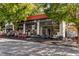 The exterior of a restaurant features outdoor seating and charming street appeal at 1311 Berwick Ne Ave, Atlanta, GA 30306