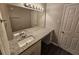 Bathroom vanity with granite countertop, double sink, decorative mirror, and modern lighting at 1968 Copperfield Cir, Decatur, GA 30035
