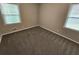 Empty bedroom featuring new carpet, a ceiling fan, and good lighting at 1968 Copperfield Cir, Decatur, GA 30035