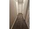 Hallway featuring neutral carpet and several doors, offering access to different rooms at 1968 Copperfield Cir, Decatur, GA 30035