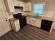 Close up of an updated kitchen featuring granite countertops and new appliances at 1968 Copperfield Cir, Decatur, GA 30035