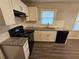 Updated kitchen showcasing granite countertops and modern appliances at 1968 Copperfield Cir, Decatur, GA 30035