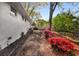 Landscaped backyard with beautiful azaleas and white brick exterior at 2322 Poplar Springs Ne Dr, Brookhaven, GA 30319