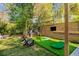 Backyard with putting green and entertainment area for the whole Gathering at 2322 Poplar Springs Ne Dr, Brookhaven, GA 30319