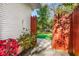 Inviting backyard with a charming red gate and lush landscaping, promising outdoor enjoyment and privacy at 2322 Poplar Springs Ne Dr, Brookhaven, GA 30319