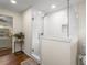 Modern bathroom showcasing a frameless glass shower with white subway tiles and an integrated niche at 2322 Poplar Springs Ne Dr, Brookhaven, GA 30319