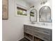 Stylish bathroom features a double vanity with shaker-style cabinets and modern lighting fixtures at 2322 Poplar Springs Ne Dr, Brookhaven, GA 30319