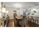 Dining room with hardwood floors, modern lighting, and access to the updated kitchen at 2322 Poplar Springs Ne Dr, Brookhaven, GA 30319