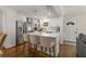 Bright kitchen with stainless steel appliances, marble countertops and pendant lighting at 2322 Poplar Springs Ne Dr, Brookhaven, GA 30319