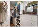 Organized walk-in closet with custom shelving, drawers, and ample storage space for clothes and accessories at 2322 Poplar Springs Ne Dr, Brookhaven, GA 30319