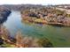 A scenic aerial view features a wide river surrounded by trees and houses at 402 River Vista Dr, Atlanta, GA 30339