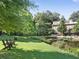 The townhome with lawn that extends to a tranquil pond, perfect for relaxation at 402 River Vista Dr, Atlanta, GA 30339