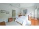 Cozy bedroom with white walls, ceiling fan, and natural light at 402 River Vista Dr, Atlanta, GA 30339