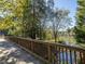 The property features a bridge with wood railings leading to the scenic river at 402 River Vista Dr, Atlanta, GA 30339