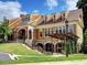 Charming clubhouse with brick and siding exterior, lush landscaping, and inviting entrance at 402 River Vista Dr, Atlanta, GA 30339