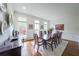 Elegant dining room with hardwood floors and natural light creating a perfect setting for gatherings at 402 River Vista Dr, Atlanta, GA 30339